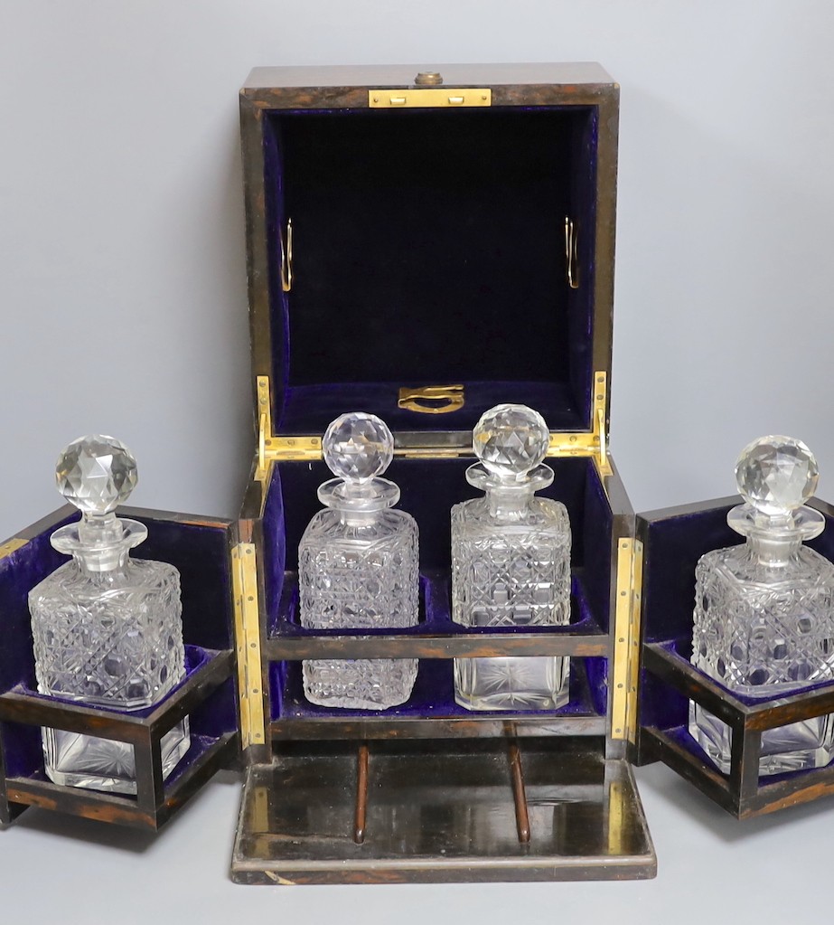 A Mappin & Webb coromandel decanter box with blue velvet lining. 32cm tall, four associated cut glass decanter and stoppers